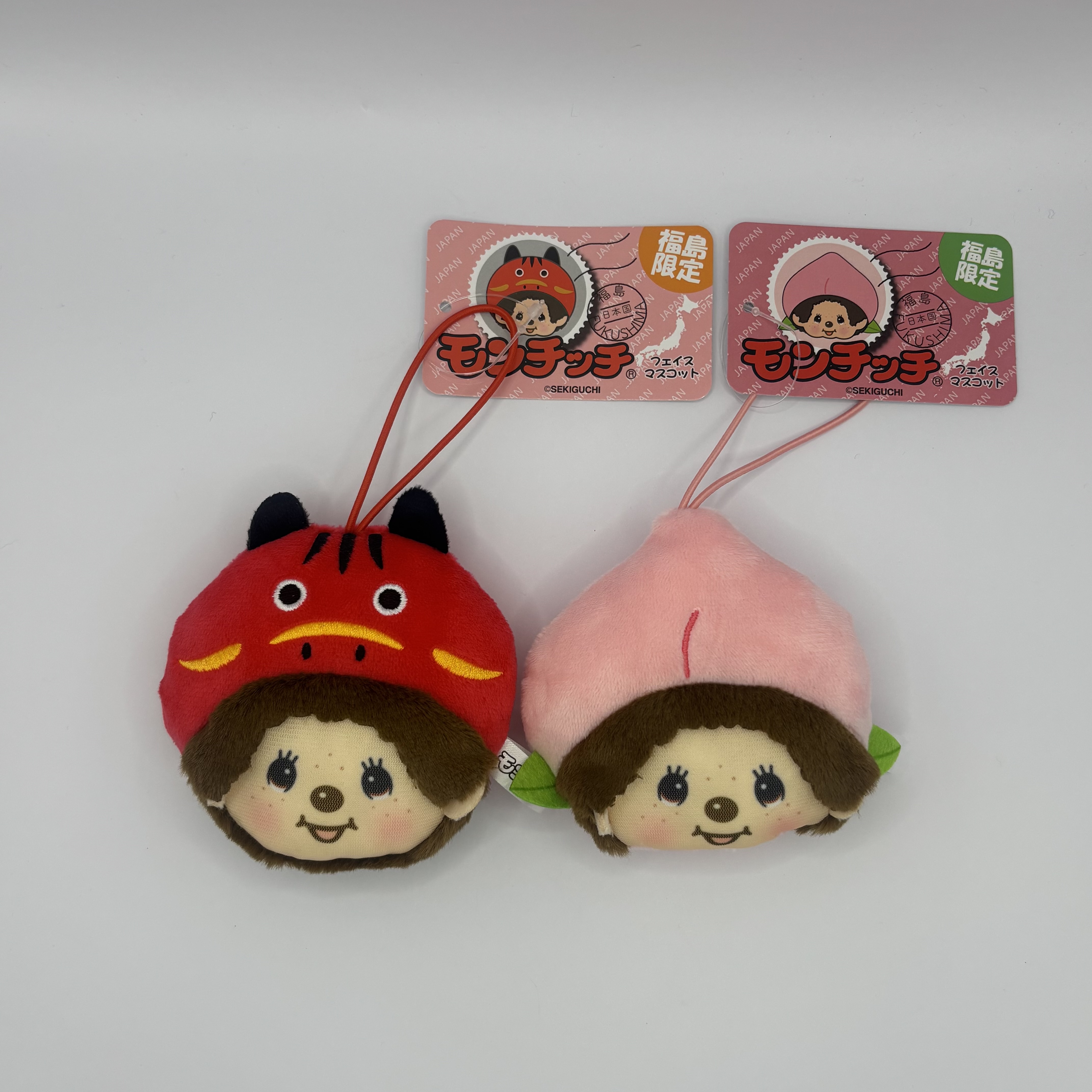 福島限定「モンチッチ フェイスマスコット〈桃〉」12月下旬より新発売